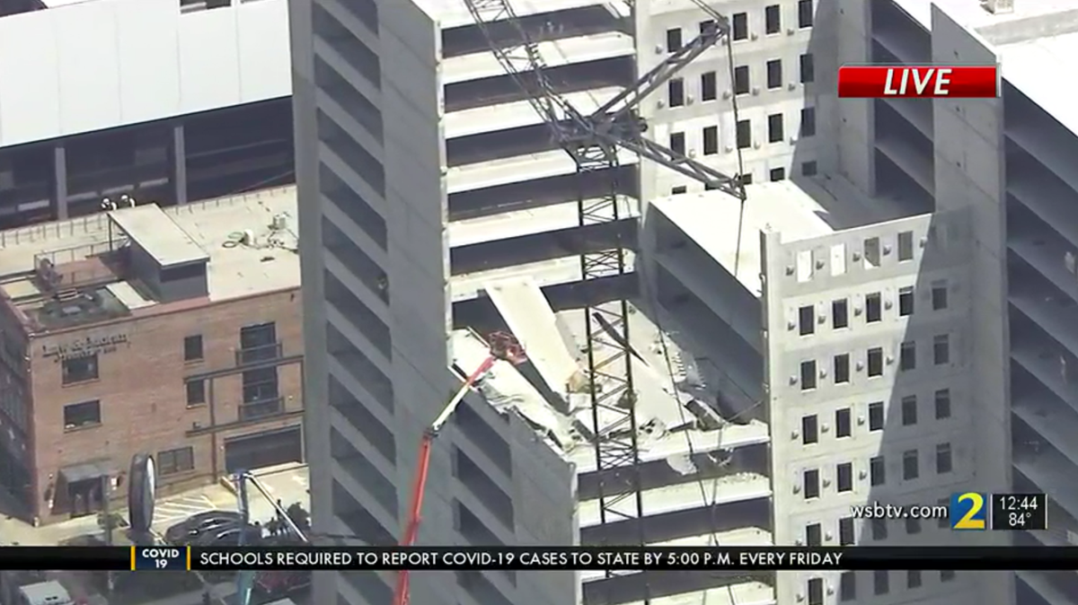 One person was trapped and at least five others injured in the partial collapse of a parking garage Friday in Atlanta.