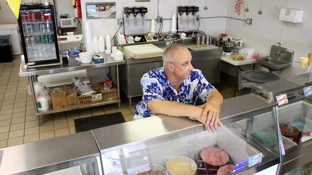 TIM ISBELL/SUN HERALDJohn Kunellis talks about the repairs he had to make at the Ice Cream Corner after April flooding damaged his shop in Orange Grove.