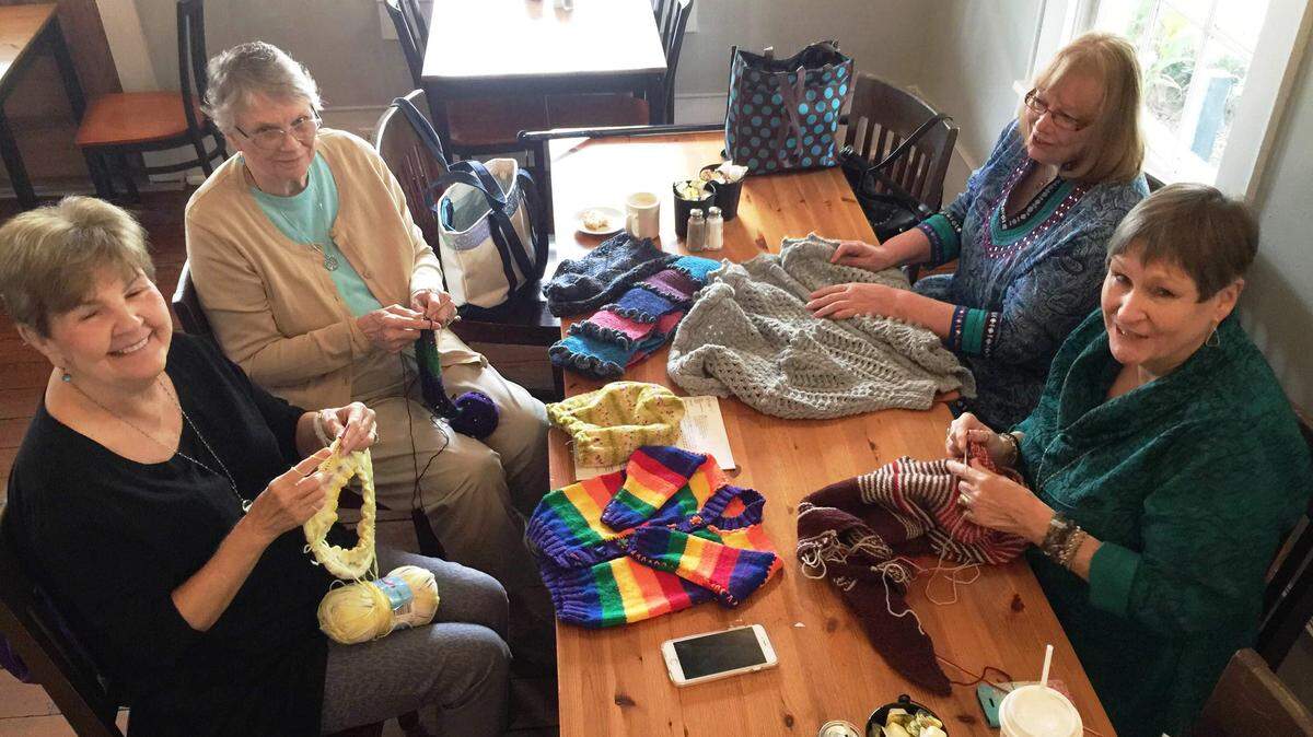 JEFF CLARK/SPECIAL TO THE SUN HERALDMembers of the Mockingbird Cafe knitting group are Deanna Castanedo, Evie Gordon, Marg Martin and Cherri McIntyre.