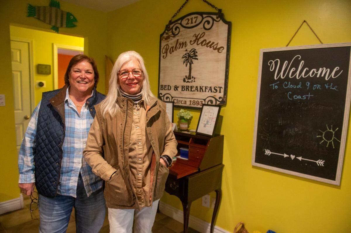 Lisa C. Johnson, right, and Maria V. Perez, who manage a short term rental in Waveland, pose for a portrait inside the home on Jan. 31, 2025.