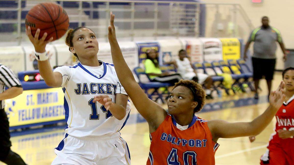 AMANDA McCOY/SUN HERALD 
 Gulfport's Jatiah Lathan, right, guards while St. Martin's Savannah Jones takes a shot during the South Mississippi All-Starr Showcase on Thursday, May 26, 2016, at St. Martin High.