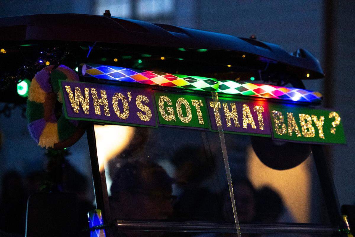 A sign on a float references king cake in Mystic Krewe of the Seahorse’s Lundi Gras parade in Bay St. Louis on Monday, March 3, 2025.