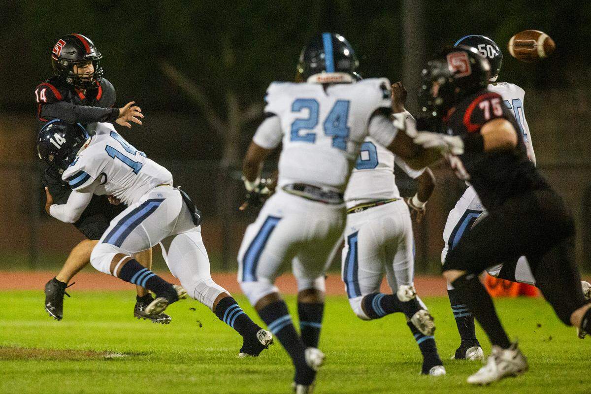St. Stanislaus’ quarterback Hudson Osborne gets tackled by Port Gibson’s Ira Thomas as he throws a pass during a playoff game against Port Gibson at St. Stanislaus in Bay St. Louis on Friday, Nov. 4, 2022.
