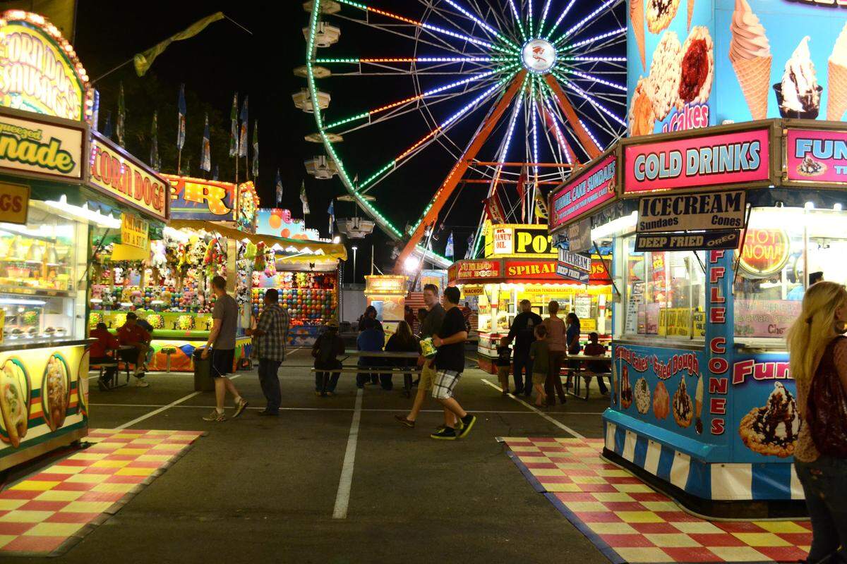 Crowds enjoy fair rides, food, desserts and beverages at the Crawfish Festival in Biloxi through Sunday, April 27.