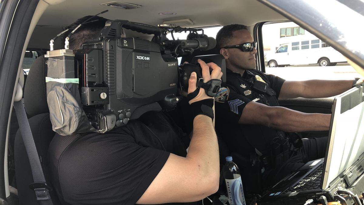 A cameraman from the COPS crime reality show films Gulfport Police Lt. Tony Alves for an episode to air on Feb. 11, 2019. The episode also includes Gulfport Patrol Officer Victor Moreno. Their appearance on Season 31, Episode 19, also can be viewed online after it debuts.
