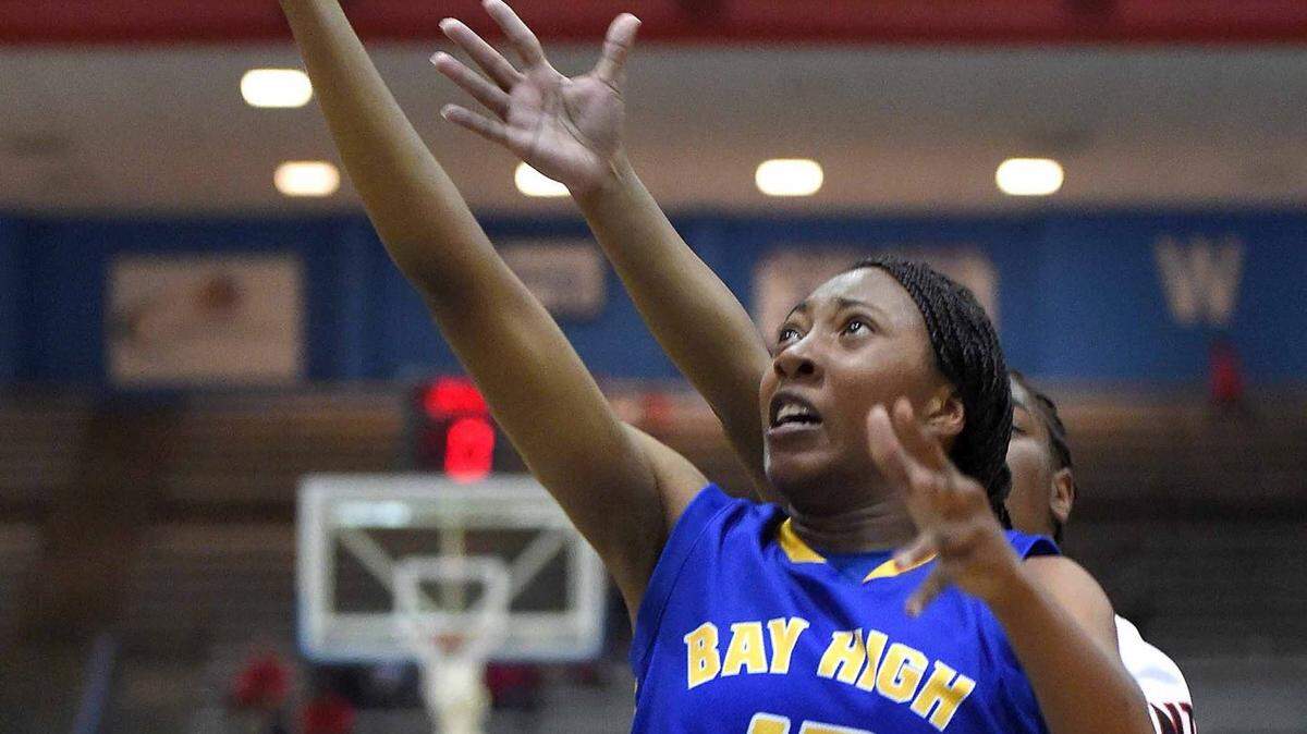 CHRIS TODD/SPECIAL TO THE SUN HERALD 
 Bay High's Amari Pittman (13) gets behind the Corinth defense for a basket on Thursday, March 3, 2016, in the MHSAA state basketball tournament quarterfinals at the Lee E. Williams Athletics & Assembly Center on the Jackson State University campus in Jackson, Miss.