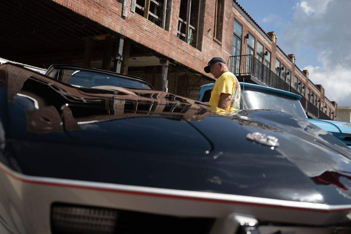 Event attendees check out cars Wednesday at the Biloxi Block Party.
