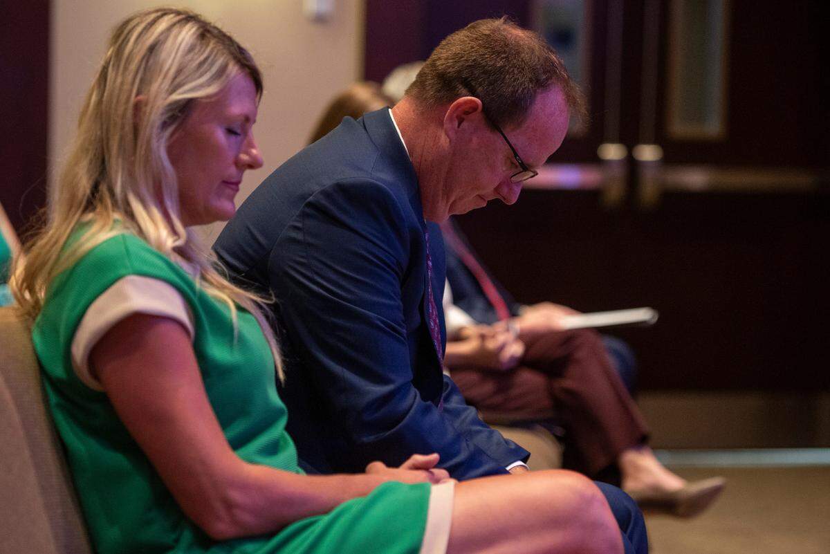 District Attorney W. Crosby Parker bows his head during a prayer as a part of a coast-wide candlelight ceremony during National Crime Victims’ Rights Week at First Baptist Church of Gulfport on Tuesday, April 29, 2025.