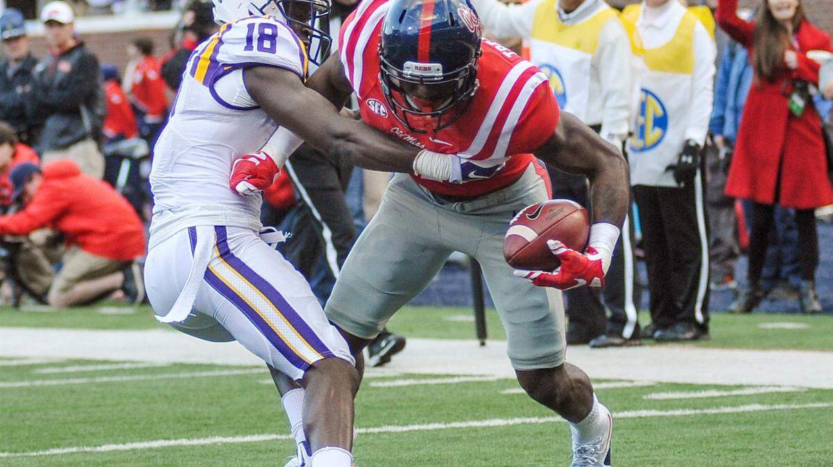 Mississippi wide receiver Laquon Treadwell, right, scores against LSU cornerback Tre'Davious White during an NCAA college football game in Oxford, Miss., on Saturday, Nov. 21, 2015. (Bruce Newman/Oxford Eagle via AP)