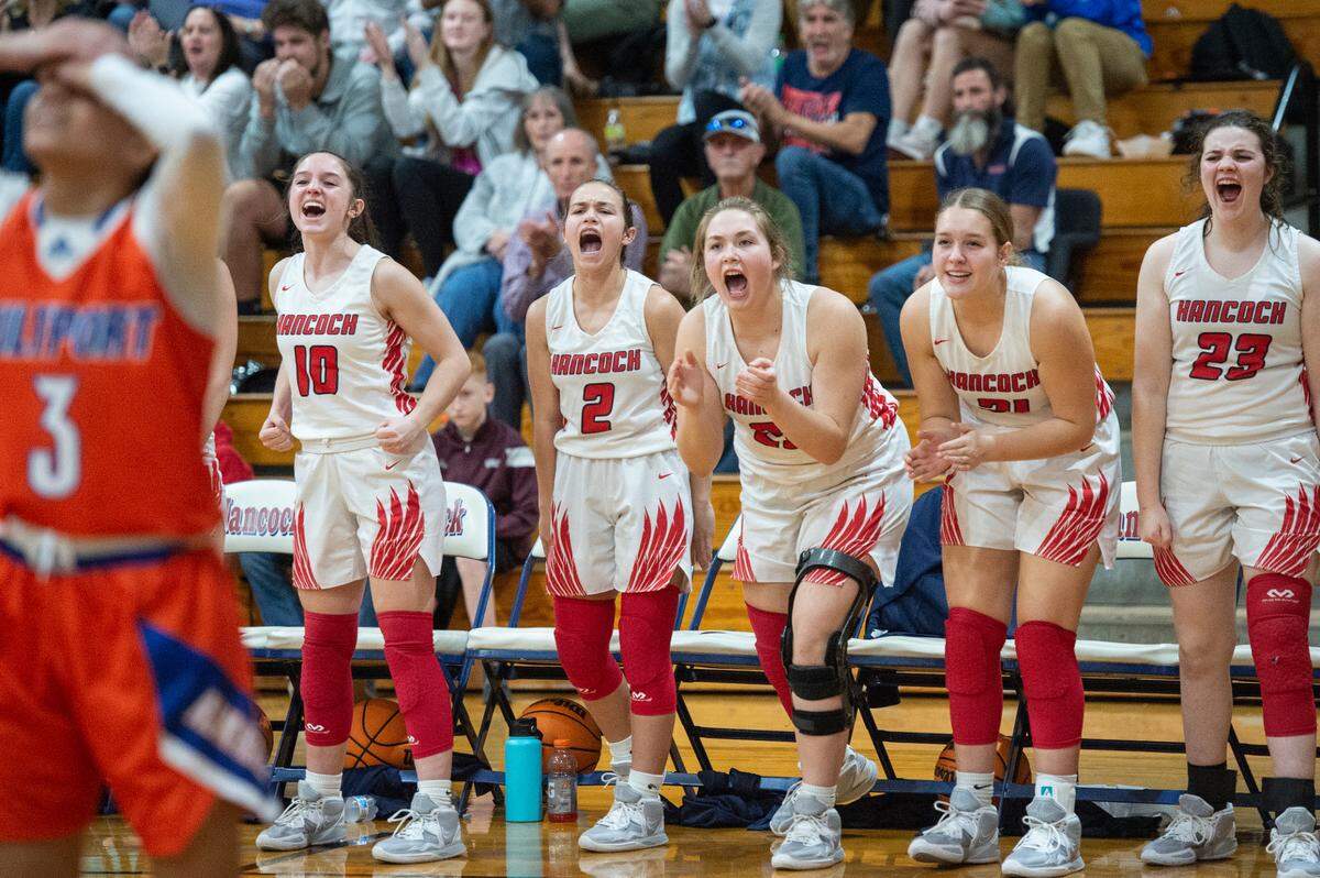 Hancock’s bench cheers for their teammates during a game against Gulfport at Hancock High School in Kiln on Tuesday, Jan. 10, 2023.