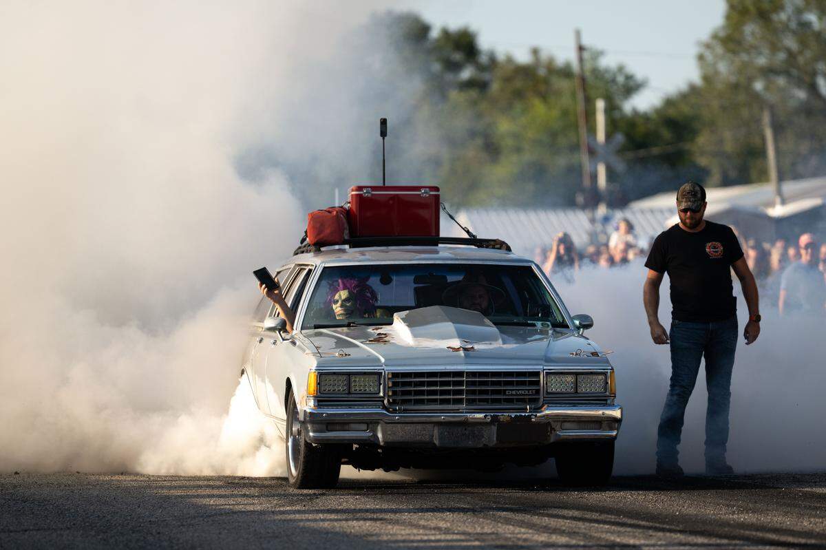 A car produces smoke as it burns out during Burn ‘Em Up In The Pass on Thursday, Oct. 9, 2025.