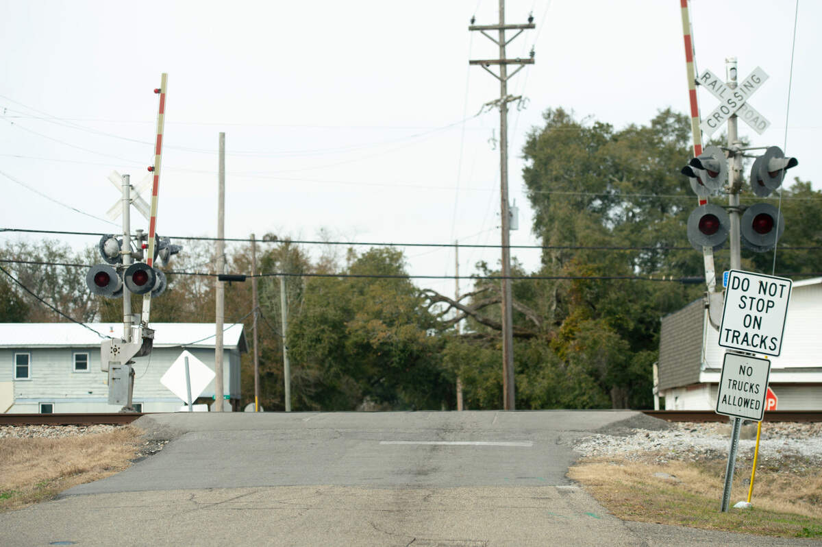 A sign warns tuckers of the steep incline at a railroad crossing on Nicholson Avenue in Long Beach on Tuesday, Jan. 28, 2025.