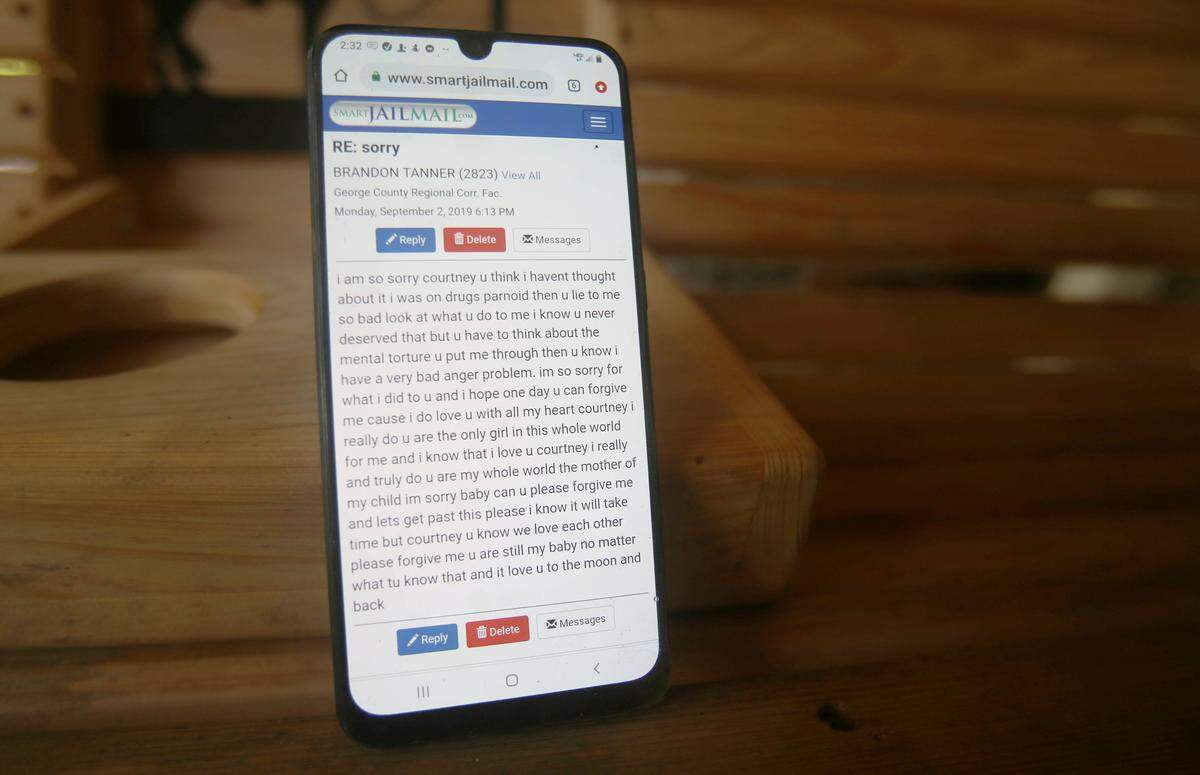 Courtney Schouest shows her phone with a message from Brandon Chase Tanner, who allegedly nearly her to death in August, asking forgiveness from the George County Regional Corrections Facility. Schouest said that Tanner sent her messages on Facebook the day after he beat her and would continue sending messages from jail after he was arrested.