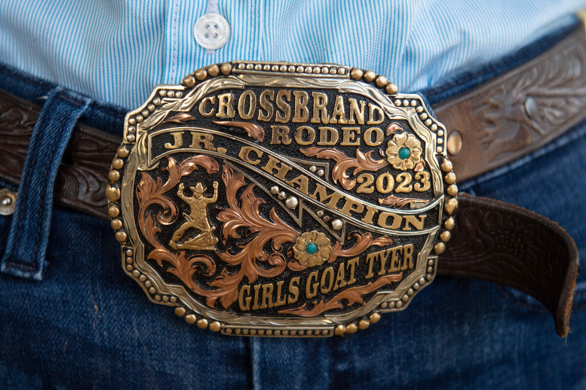 Kinsley McBride wears a championship belt buckle during practice at the Harrison County Fairgrounds on Thursday, June 13, 2024. McBride, who is a member of the Mississippi Junior High Rodeo Association team, will compete at the National Junior High Finals Rodeo in Des Moines, Ia.