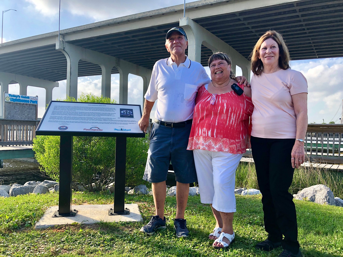 Calvin Parker, left, stands with family at the historical marker in Pascagoula that depicts the night he and the late Charles Hickson say they were abducted by aliens 45 years ago.