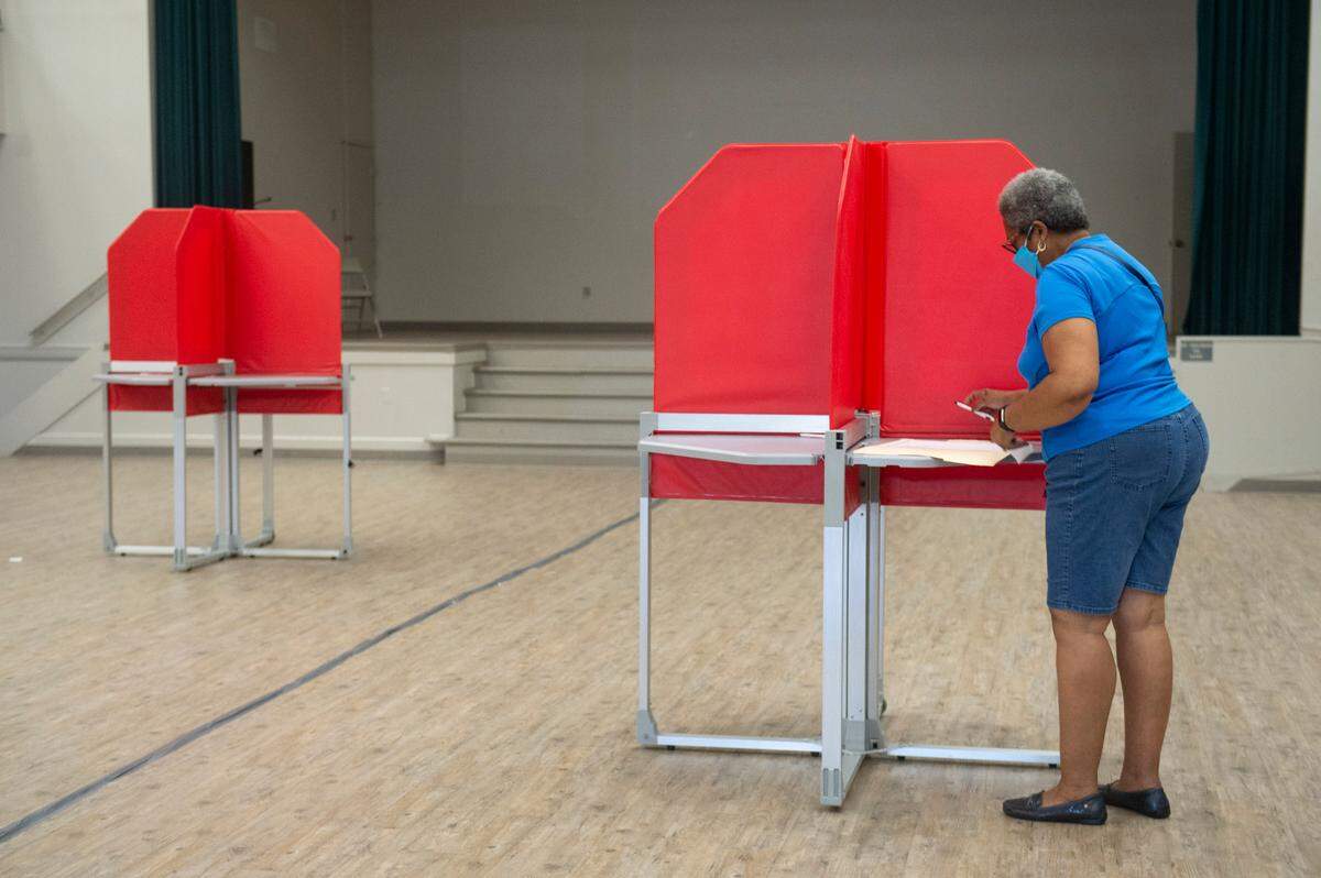 A voter fills out a paper ballot at the D’Iberville Civic Center in D’Iberville on Tuesday, June 7, 2022.