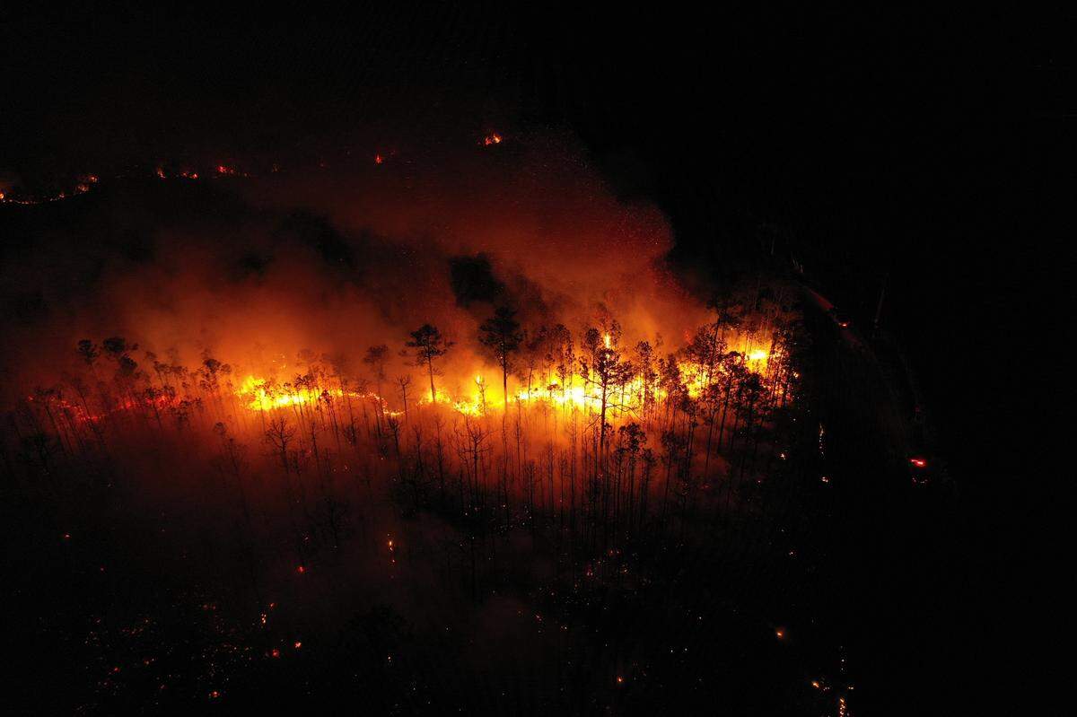 A drone photo shows a forest fire that has burned an estimated 300 to 400 acres of woods near Gulf Park Estates and the Mississippi Sandhill Crane National Wildlife Refuge on Saturday, April 9, 2022.