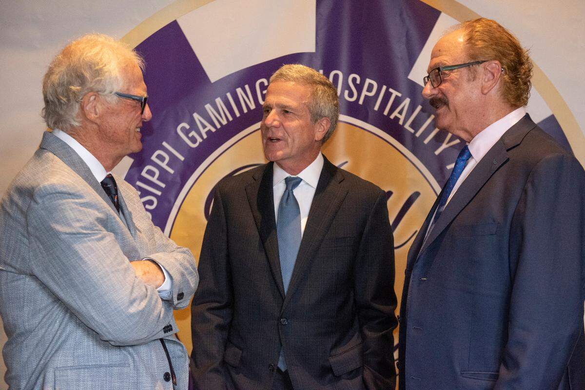 Mississippi Gaming and Hospitality Association Hall of Fame inductees Tim Hinkley, left, Tom Gresham, and Jon Lucas, right, chat during the Mississippi Gaming and Hospitality Association Hall of Fame Gala at the Beau Rivage in Biloxi on Thursday, June 27, 2024.