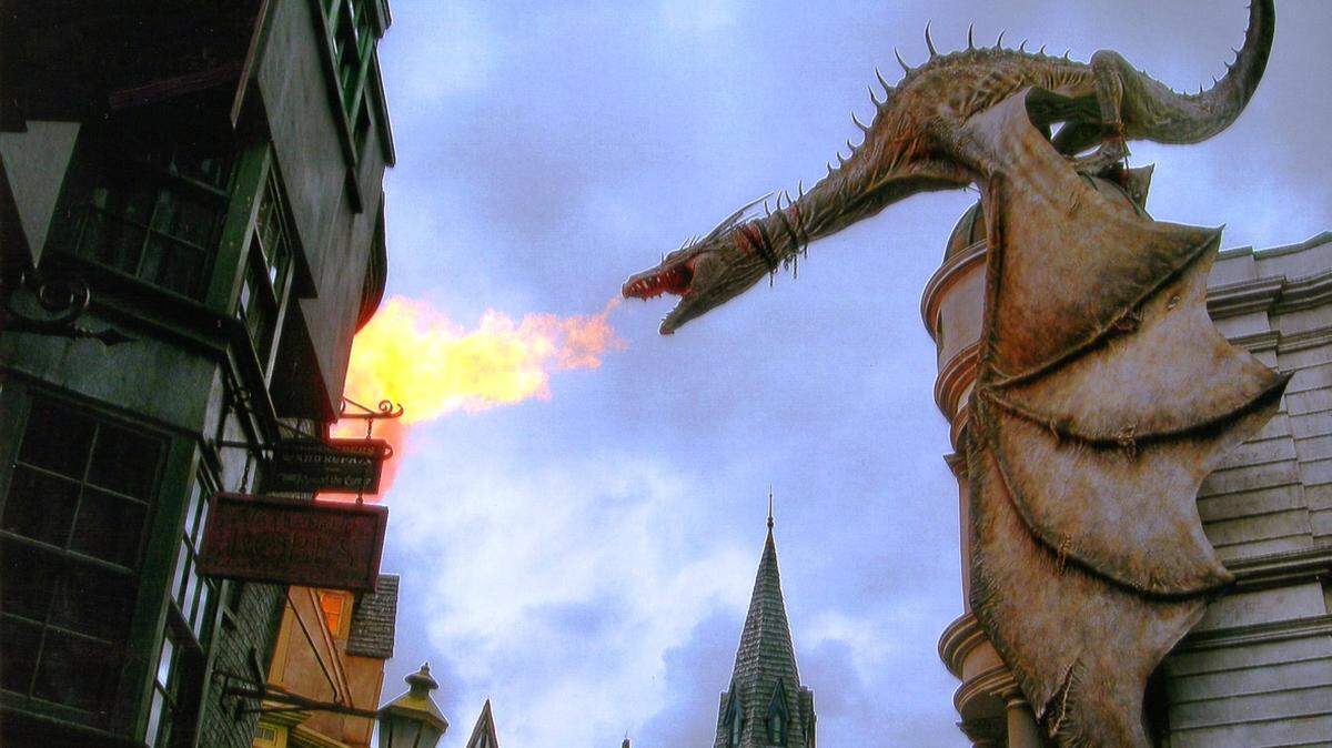KAT BERGERON/SPECIAL TO THE SUN HERALDIt's not your imagination. A dragon roars real flames from atop its perch on Gringotts Bank, in one of the village scenes from The Wizarding World of Harry Potter, a popular destination for those who visit the Universal Orlando theme park in Florida, in a city with more than 26 theme parks.