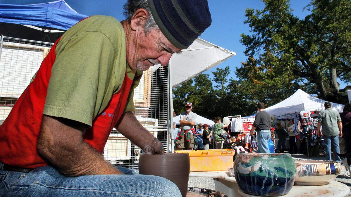 WILLIAM COLGIN/SPECIAL TO THE SUN HERALD/FILECoast potter Ray Bellande demonstrates the art of throwing pottery during a previous Peter Anderson Arts & Crafts Festival. This year's festival opens from 9 a.m. to 5 p.m. Saturday and Sunday in downtown Ocean Springs.
