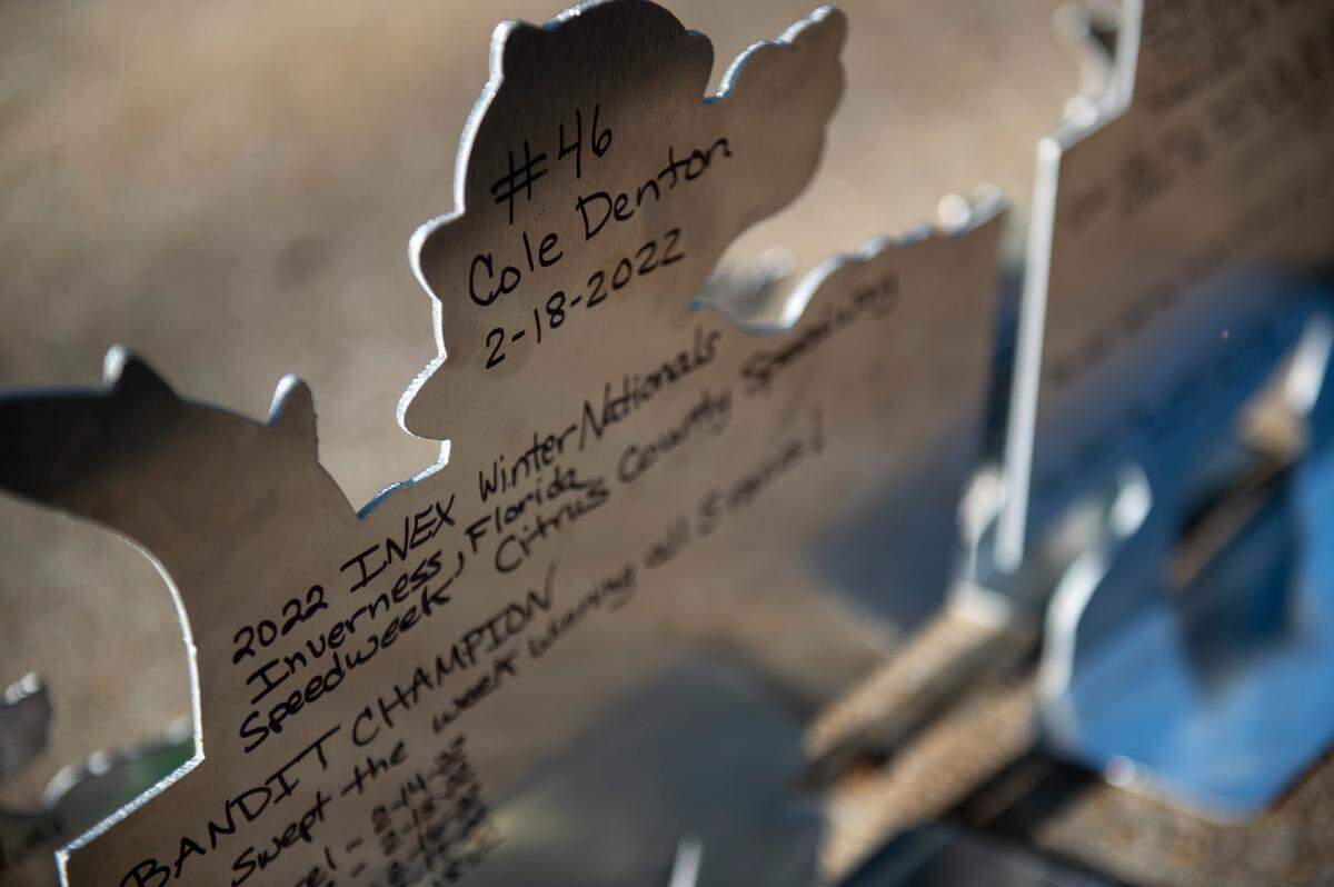Cole’s mother Tina wrote down the details of one of Cole’s races on the back of a trophy he won during the race.