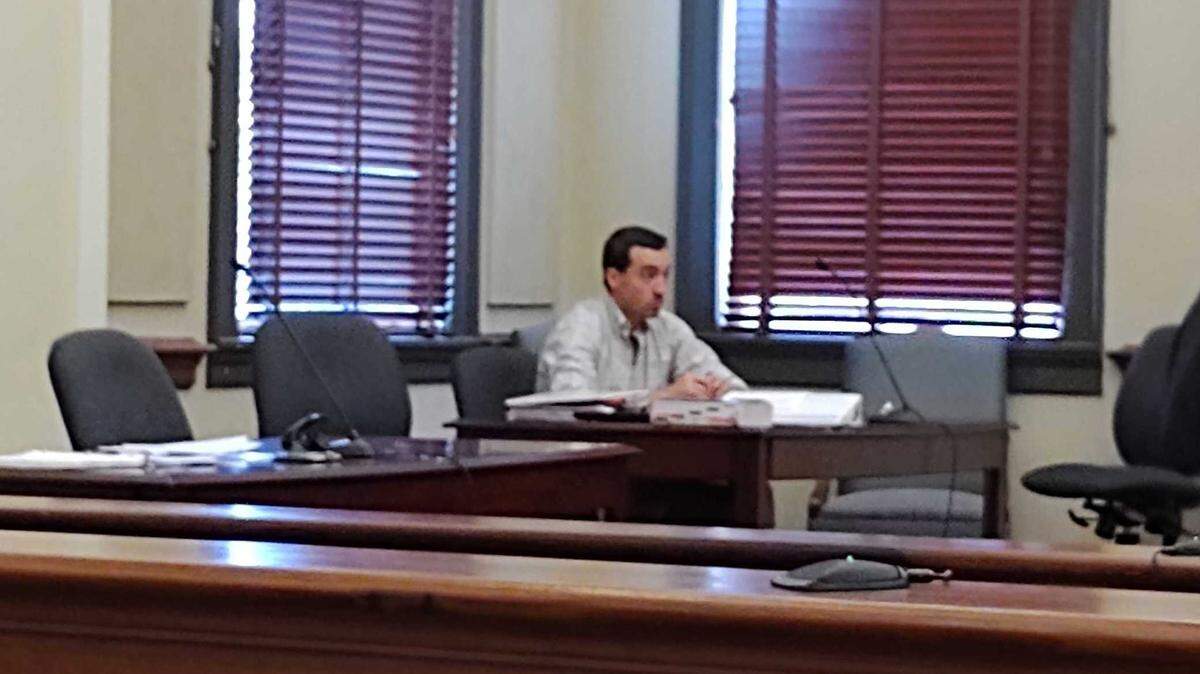 Former Diamondhead Councilman Alan Moran sits during a preliminary hearing during a felony child sex crimes case on April 15, 2022, at the Hancock County Courthouse in Bay St. Louis.