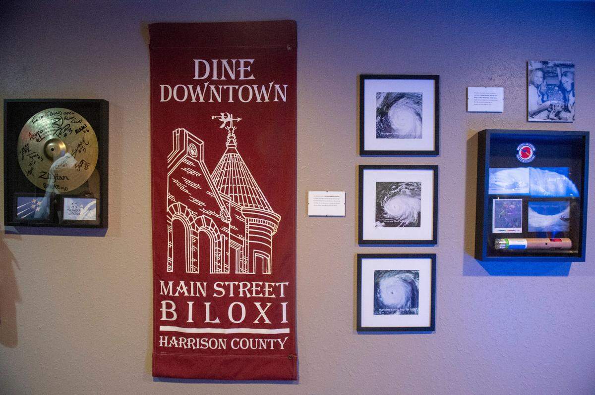Photographs and memorabilia from Biloxi and Hurricane Katrina line the walls of Ground Zero’s new lounge space at their Biloxi location on Wednesday, May 21, 2025.