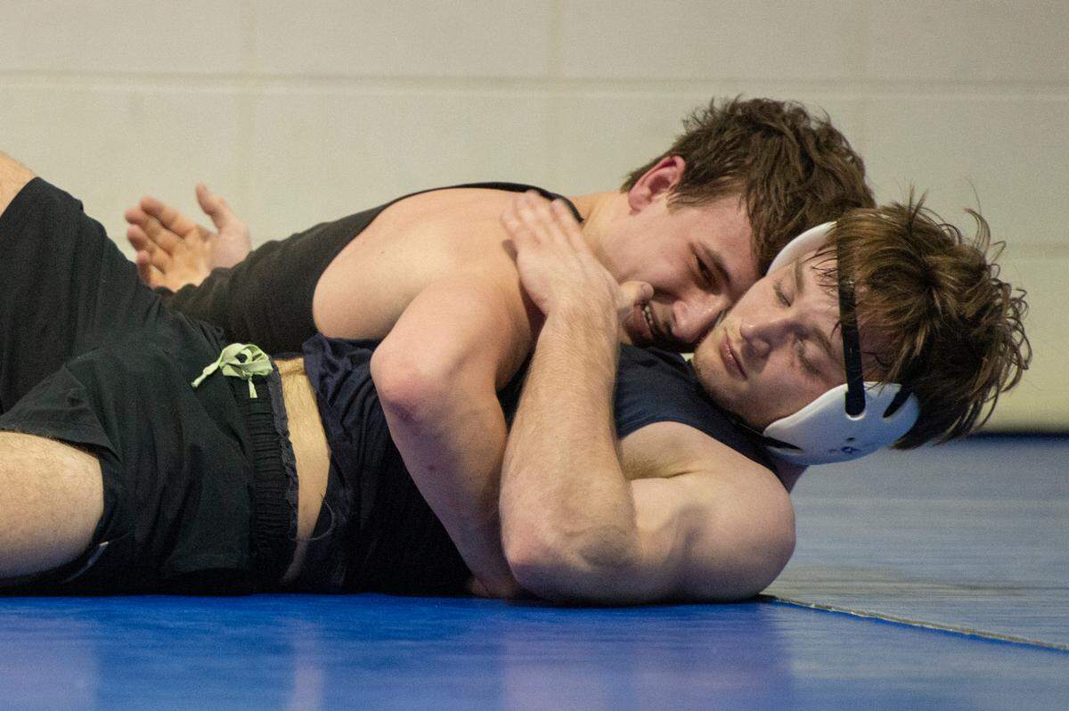 Gabe Beeman taps out as he practices with Jared Barr during Ocean Springs’ high school wrestling practice at E.H. Keys Alternative Education Center on Thursday, Feb. 8, 2024.