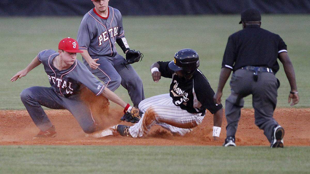 TIM ISBELL/SUN HERALDPetal second baseman Samuel Hopper tags D'Iberville's Luther Woullard as shortstop Chance Holton backs up the play, Friday, Apr. 22, 2016. Woullard was safe. 
