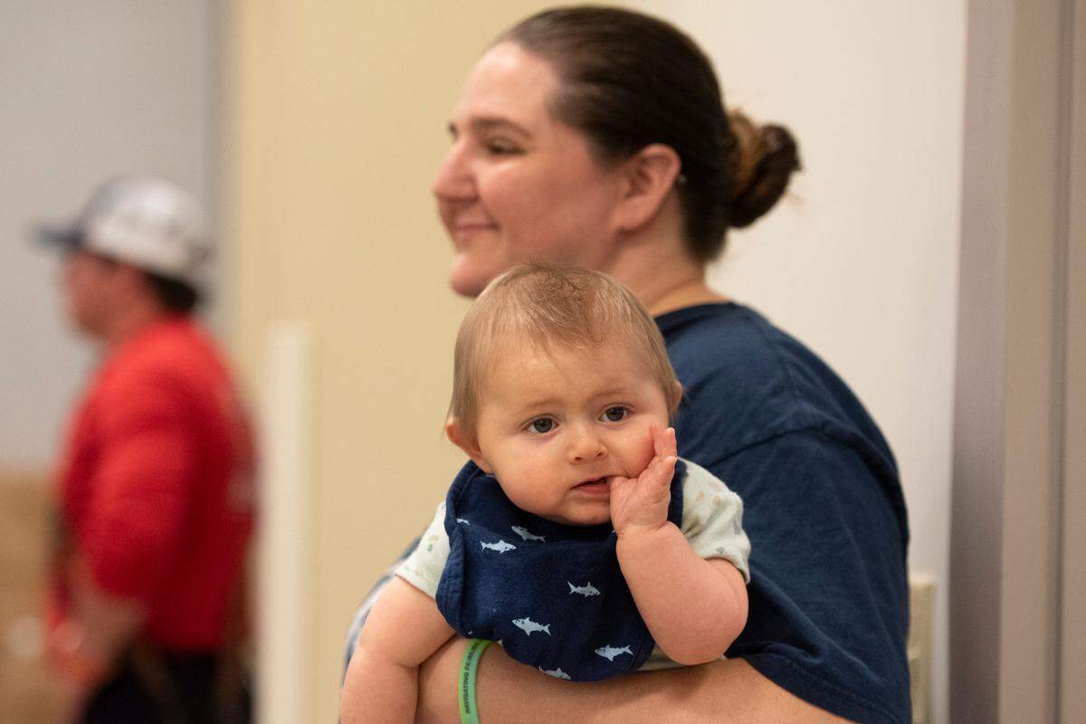 Candy Smith holds her son Kayden Smith during a community baby shower event at Lyman Community Center in Gulfport on Thursday, Nov. 14, 2024.