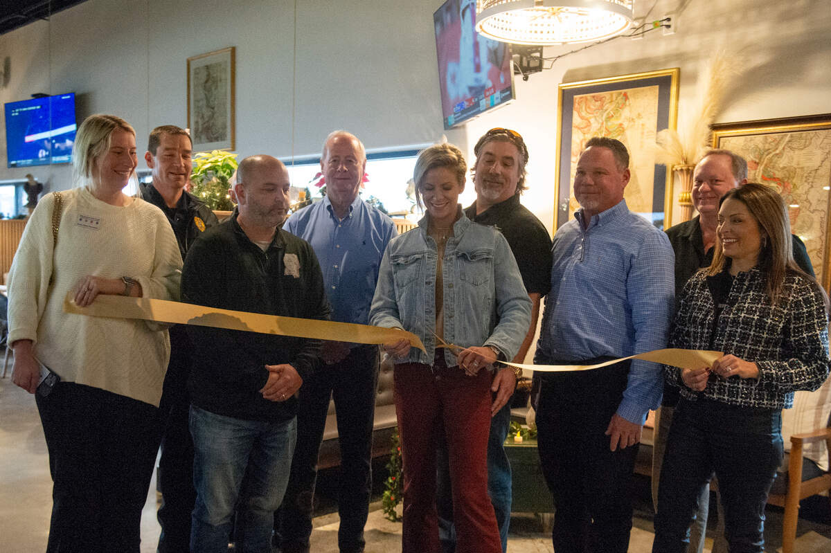 Owners of Coterie and representatives from the city of Long Beach cut a ribbon at Coterie Restaurant and Oyster Bar in Long Beach on Thursday, Dec. 14, 2023 for their grand opening.