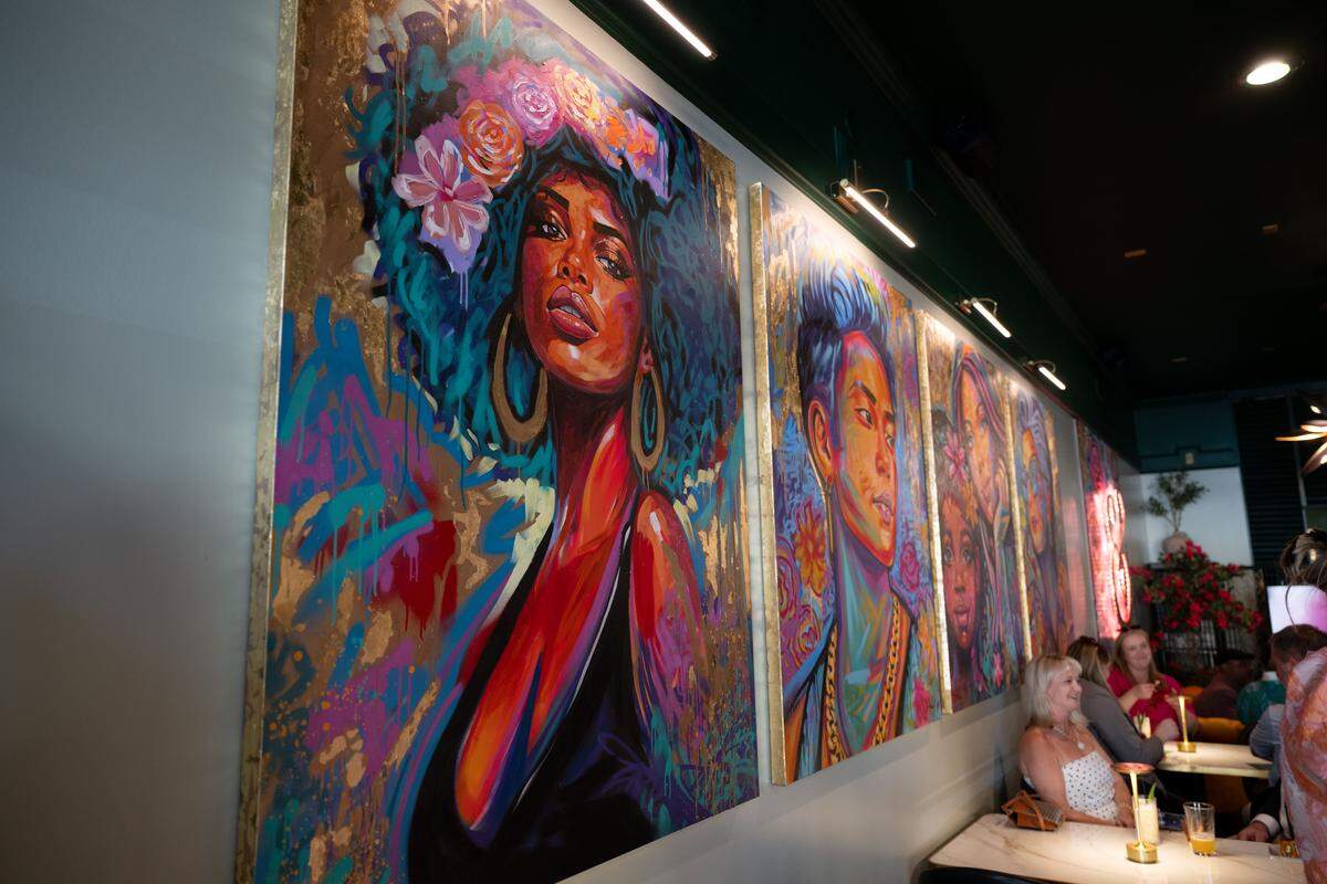 Art is displayed during Thursday’s soft opening at Neighbors Tap & Table.