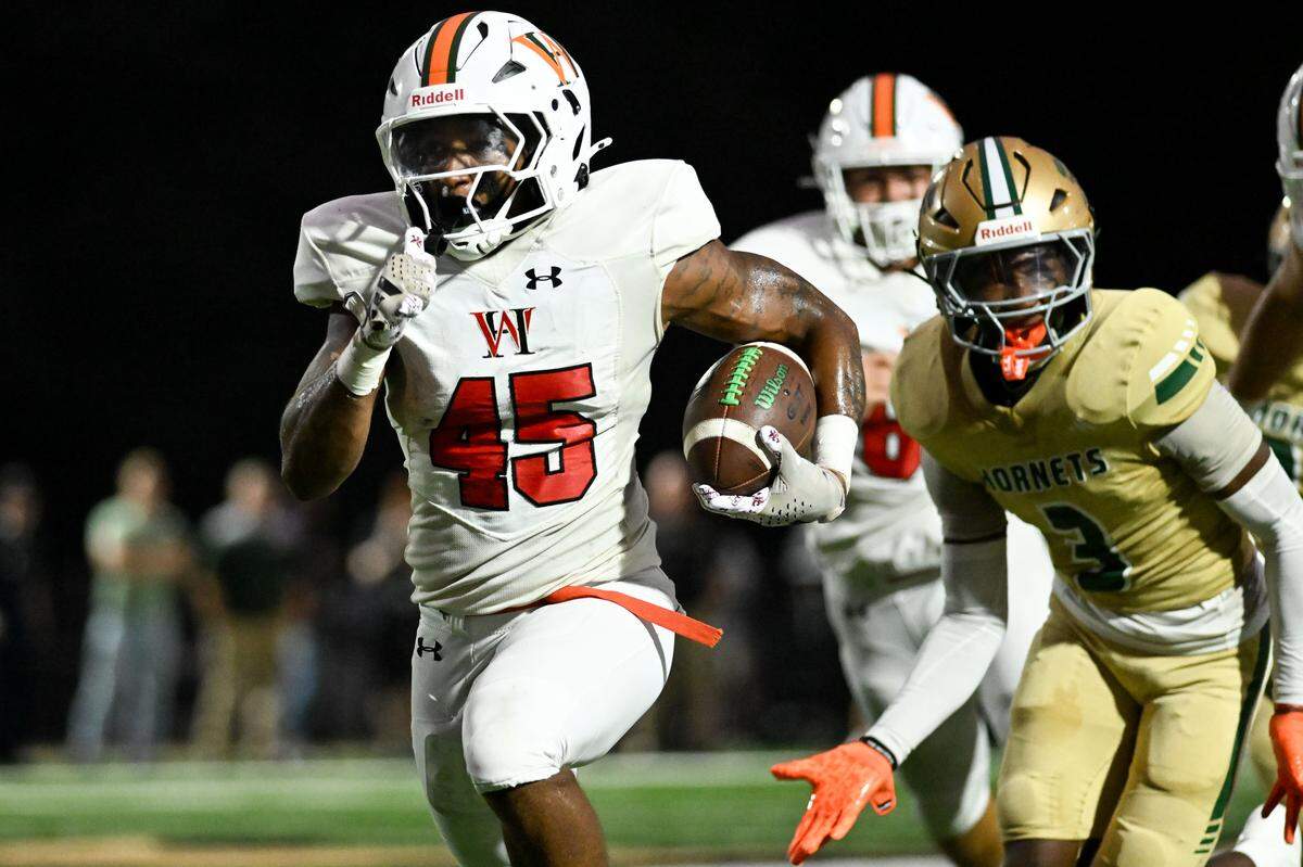 West Harrison’s Jordan Stapleton (45) runs the ball for a touchdown during a high school football game at Poplarville High School on Friday, August. 29, 2025. West Harrison won 34-18.