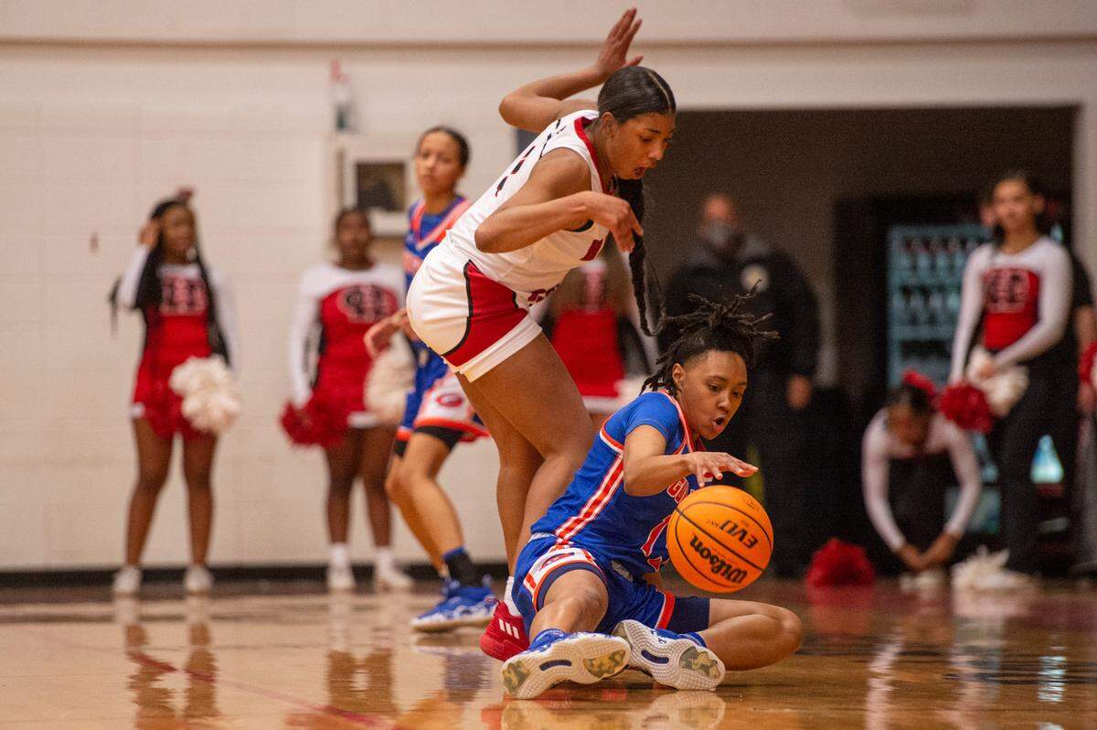 Gulfport’s Simaru Fields, right, chases the ball after losing control of it during a game against Harrison Central at Harrison Central High School in Gulfport on Friday, Feb. 4, 2022.
