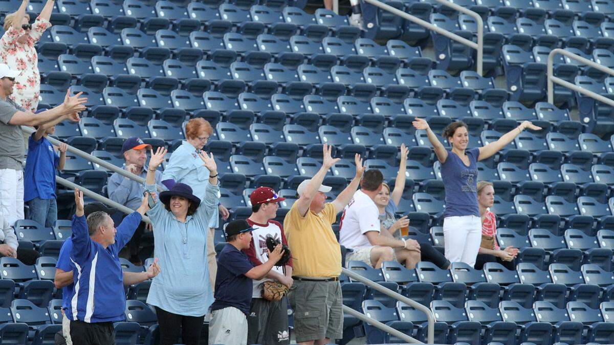 JOHN FITZHUGH/SUN HERALD 
 Biloxi Shuckers fans on the third base side call for t-shirts between innings of the team's opening game of the season at MGM Park in Biloxi on Thursday April 7, 2016.