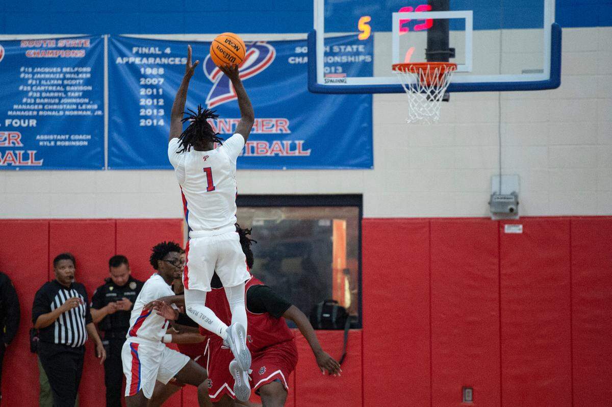 Pascagoula’s Dorian Mcmillian shoots a three pointer during a game against Harrison Central at Pascagoula High School on Tuesday, Dec. 5, 2023.