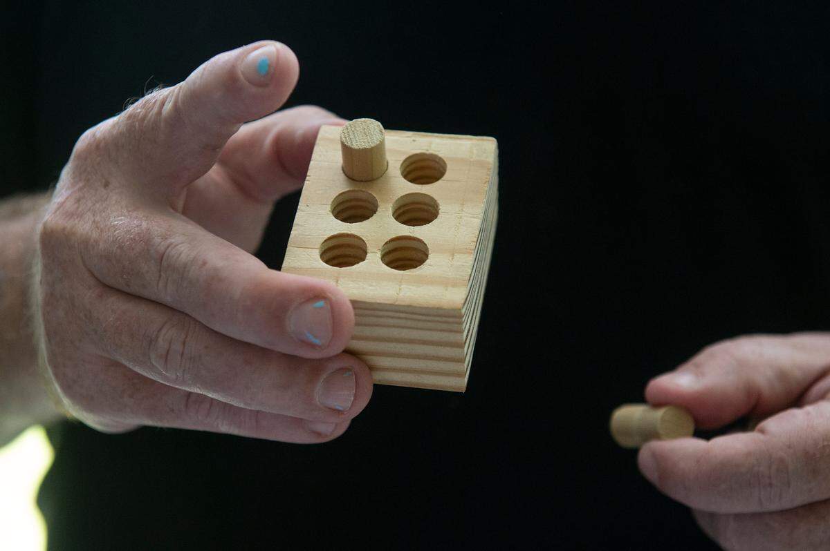 Andy Weller, a braille instructor at the Mississippi Emerge Center, shows off a tool to help teach braille on Thursday, July 25, 2024.
