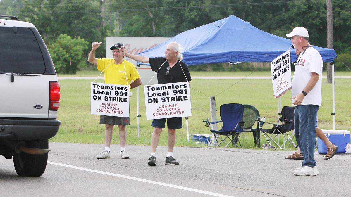 Teamsters Local 991 members Shannon Trochesset of Ocean Springs, from left,  Adam Hebert of Biloxi and Michael Toothman of D’Iberville picket in July 2008 in  front of the CoCa-Cola Bottling Company Consolidated plant in Vancleave.