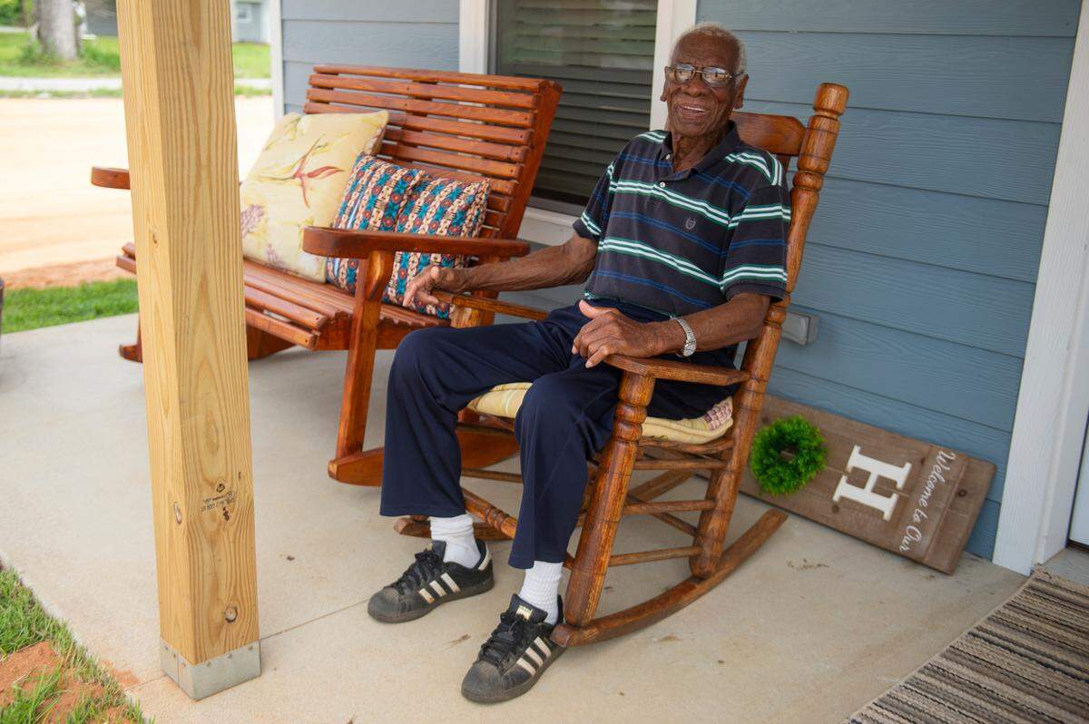 Ernest Watson, 96, poses for a portrait outside his new home in Moss Point on Tuesday, June 18, 2024. Watson’s home was rebuilt by Amish volunteers after a devastating tornado destroyed his old home in June 2023.