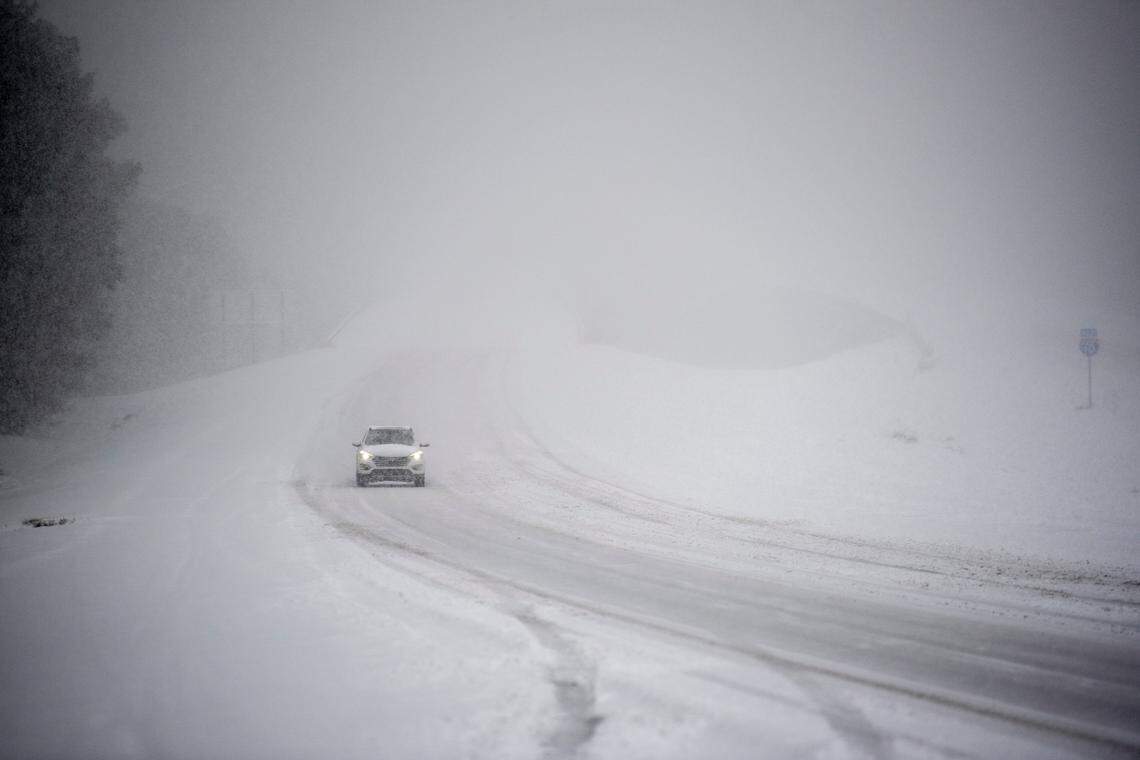 A lone driver braves the elements on I-10 Tuesday, Jan. 21, 2025, during a rare South Mississippi winter storm.