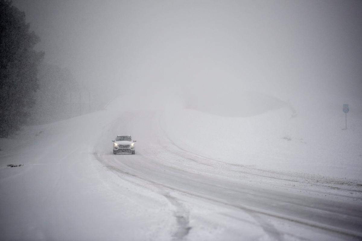 A lone driver braves the elements on I-10 Tuesday, Jan. 21, 2025, during a rare South Mississippi winter storm.