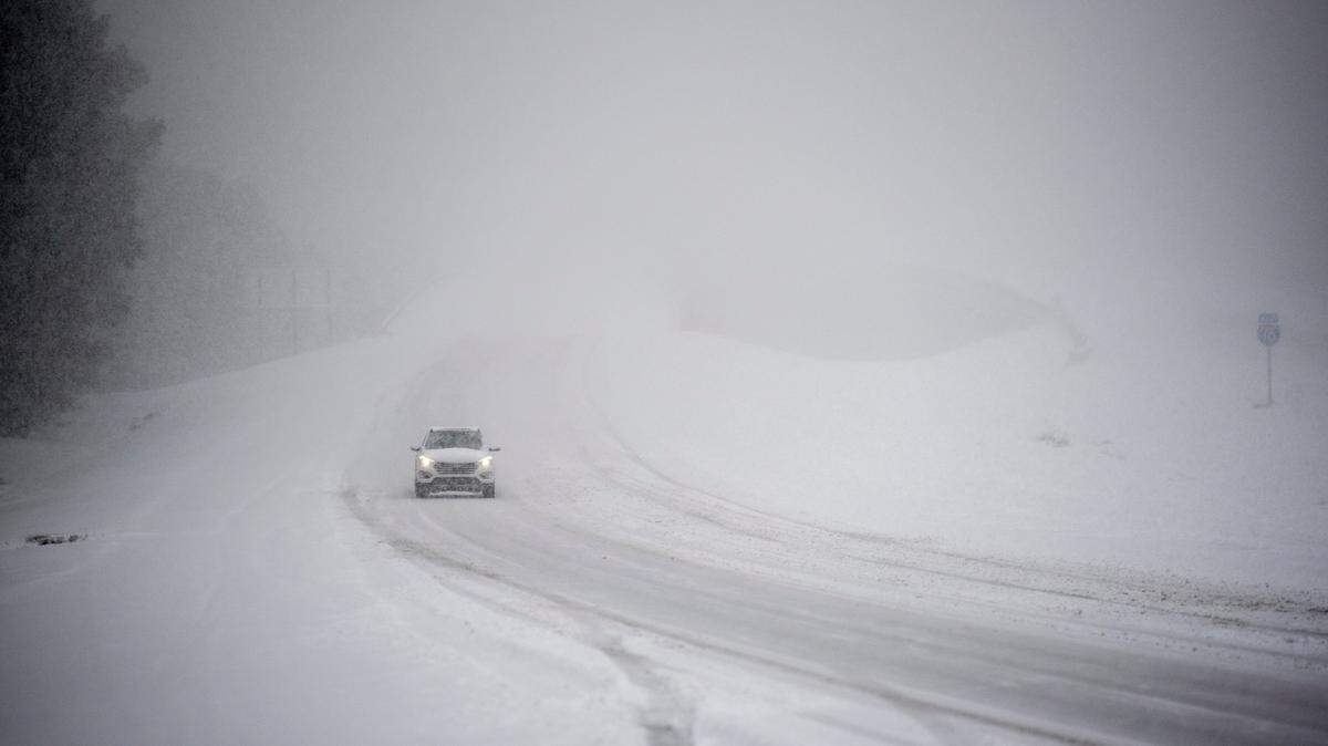 A lone driver braves the elements on I-10 Tuesday, Jan. 21, 2025, during a rare South Mississippi winter storm.