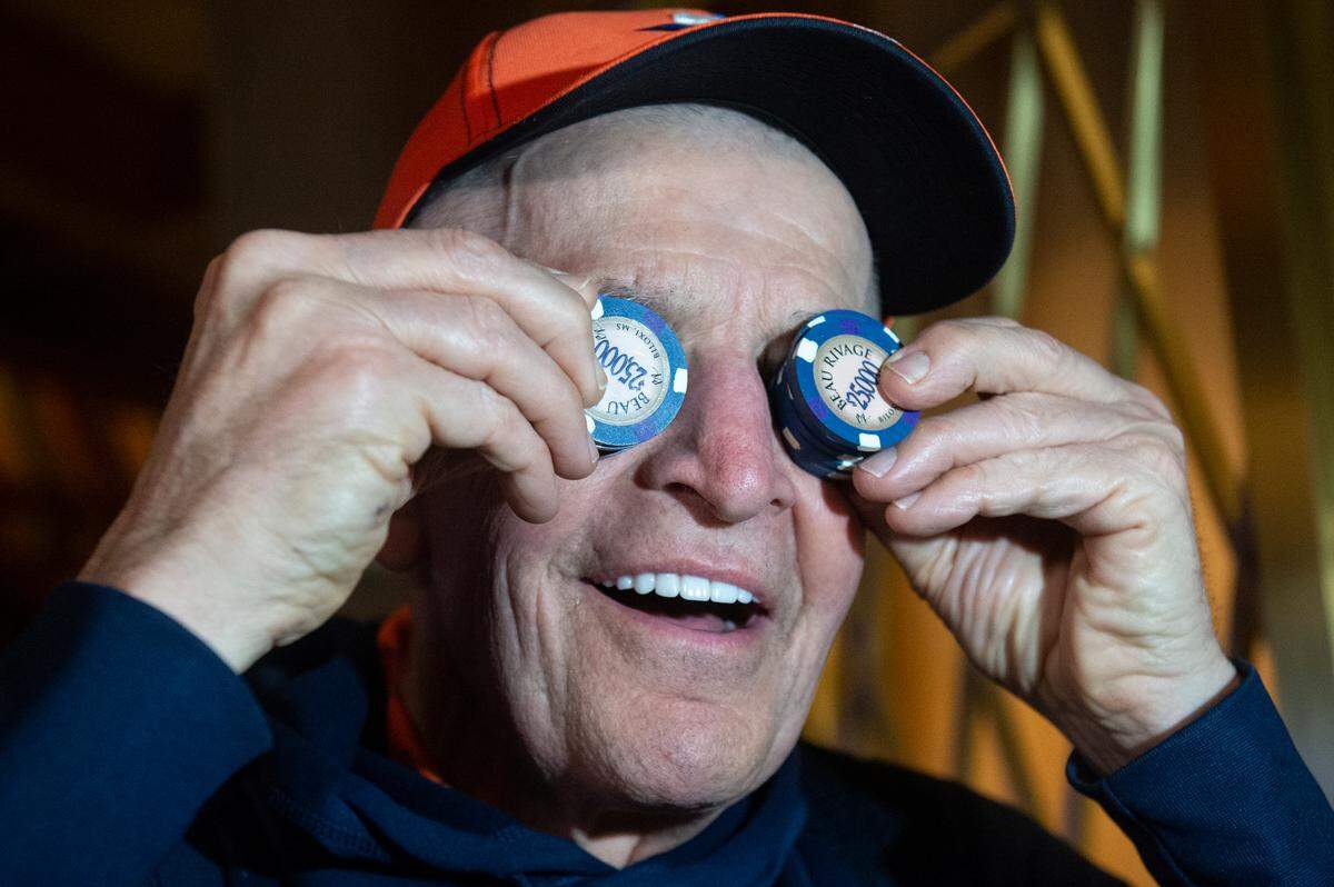 Jim McIngvale, better known as ‘Mattress Mack’, holds up $25,000 chips over his eyes before placing a $500,000 bet on the Houston Cougars Men’s Basketball team to win the NCAA Tournament at the Beau Rivage in Biloxi on Tuesday, Nov. 15, 2022.