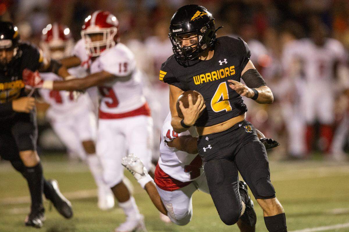 D’Iberville’s London Adams runs the ball down the field during a game against Biloxi at Warriors Stadium in D’Iberville on Friday, Sept. 23, 2022.
