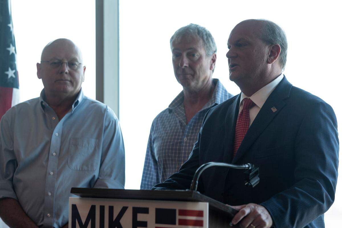 Former Republican congressional candidates Brice Wiggins, right, Clay Wagner, center, and Carl Boyanton express their support for Mike Ezell, who will run against incumbent Steven Palazzo in a runoff election, during a press conference at the Great Southern Club in Gulfport on Thursday, June 9, 2022.