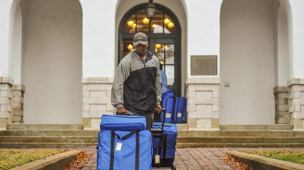 Richard Dennis rolls voting machines to a hauler outside the Lafayette County Courthouse in Oxford on Oct. 28. The machines will be tested and taken to their respective polling places on Monday. Mississippians go to the polls Nov. 3 to vote on state and county races.