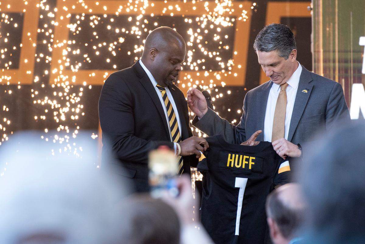 Southern Miss Athletic Director Jeremy McClain poses with new head football coach Charles Huff during a public welcome celebration for Huff at The Rock in Hattiesburg on Thursday, Dec. 12, 2024.