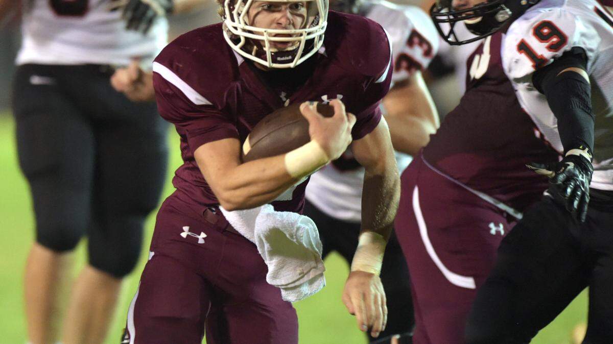 GLENN ANDREWS/SPECIAL TO THE SUN HERALD 
 East Central running back A.J. Davis (21) carries the ball past St. Stanislaus free safety Jacob Greer (19) for a touchdown during the second quarter, Friday, Oct. 16 2015, in Hurley, Miss.