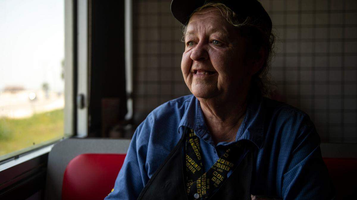 Vicky Dean, a server at Waffle House, poses for a portrait at Waffle House in Gulfport on Wednesday, July 28, 2021. Dean has had to take the bus to work after her car was damaged, according to Dean, by Oscar Renda.