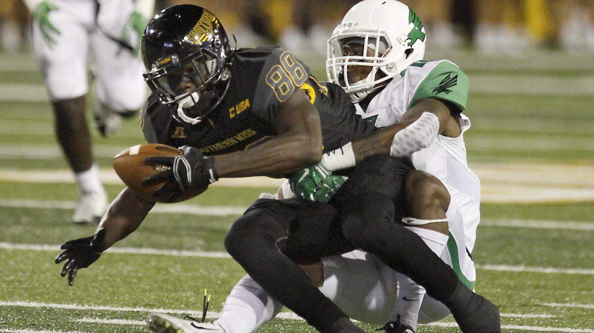TIM ISBELL/SUN HERALD 
 Southern Miss receiver Mike Thomas stretches for a first down against North Texas on Oct. 3 in Hattiesburg. USM hosts UTSA at 6 p.m. on Saturday.
